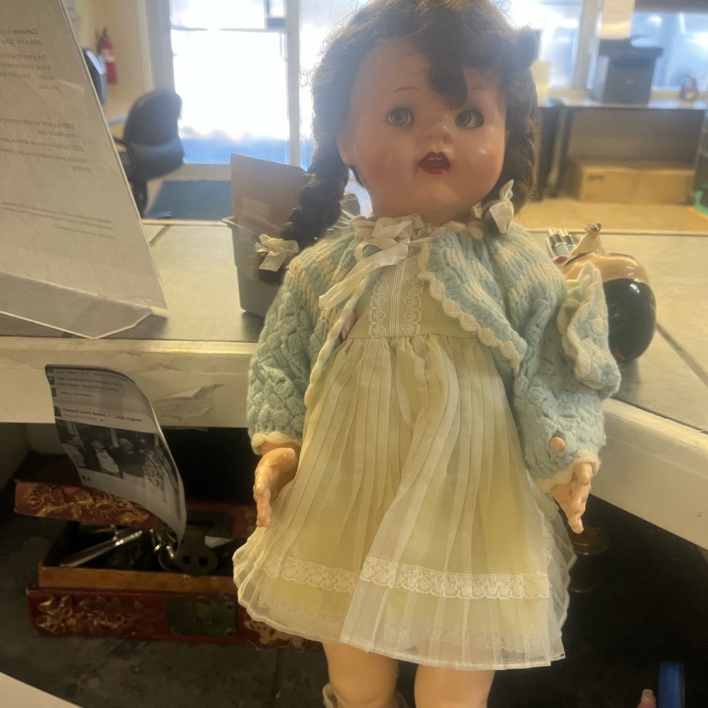 Adorable Doll with Light Blue Sweater and Cream Dress